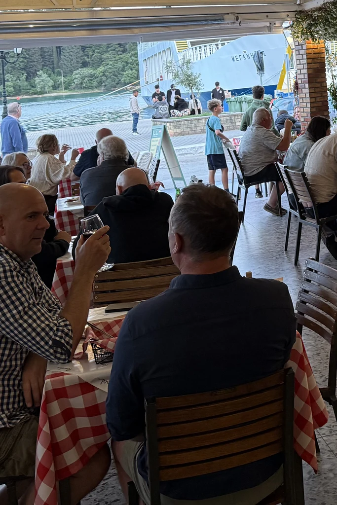 Guests dining on the Pomodoro terrace by the Nydri waterfront