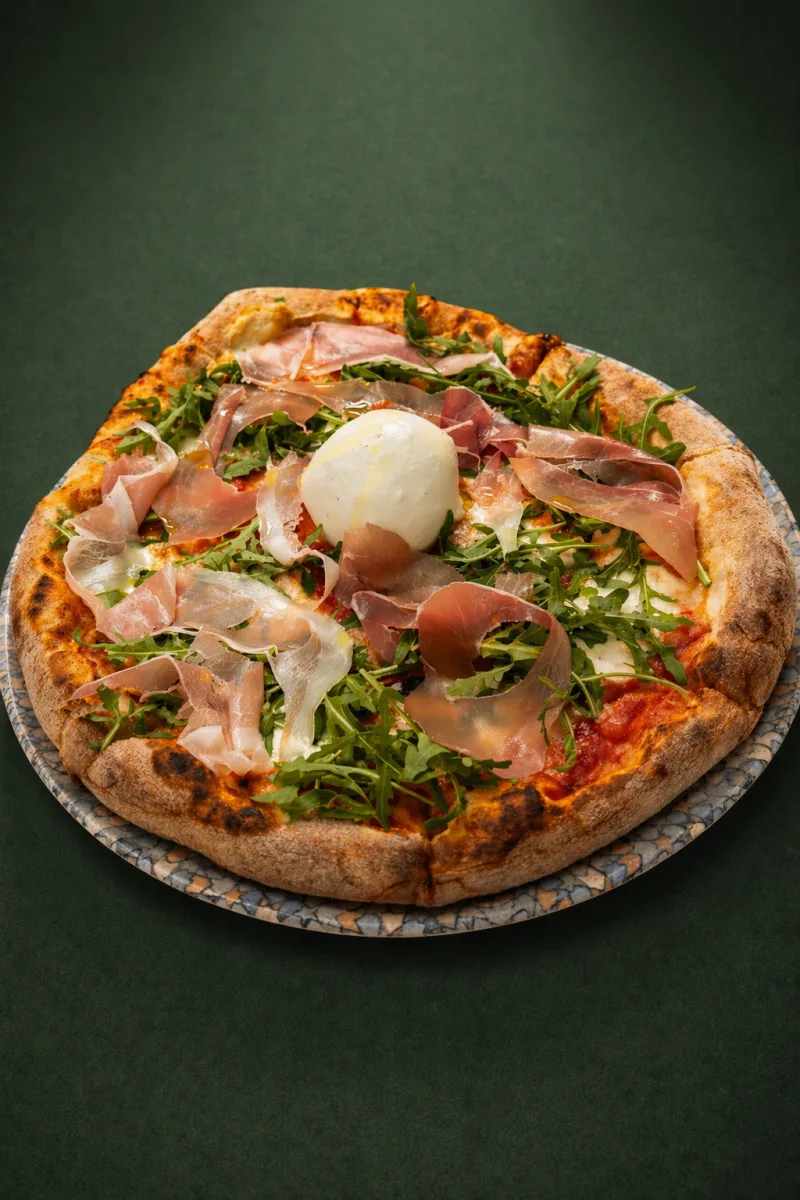 Wood-fired pizza with prosciutto, rocket and burrata